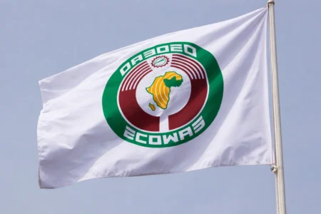 Flag of the Economic Community of West African States (ECOWAS) flying against the sky