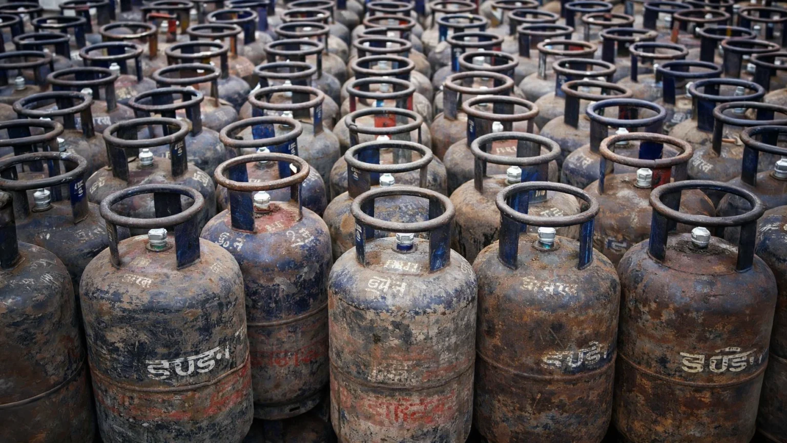 Commercial LPG cylinders stacked at a gas agency during supply shortage