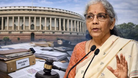 Lok Sabha Passes IBC Amendment Bill: Why the Changes Matter for Banks, Companies and Homebuyers Finance Minister Nirmala Sitharaman addressing media with Parliament and insolvency case documents representing IBC amendment bill passage