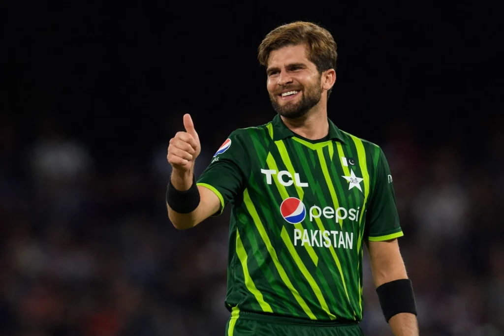 Pakistan fast bowler Shaheen Shah Afridi smiling during a cricket match in Pakistan green jersey