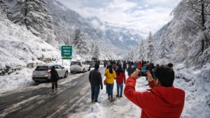 Tourists walking on a snow-covered road in Himachal Pradesh mountains after fresh snowfall